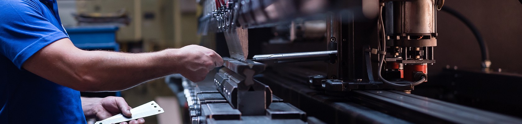 person using manufacturing machine